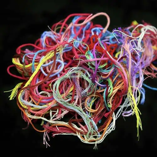 ball of multicolored tangled threads for needlework