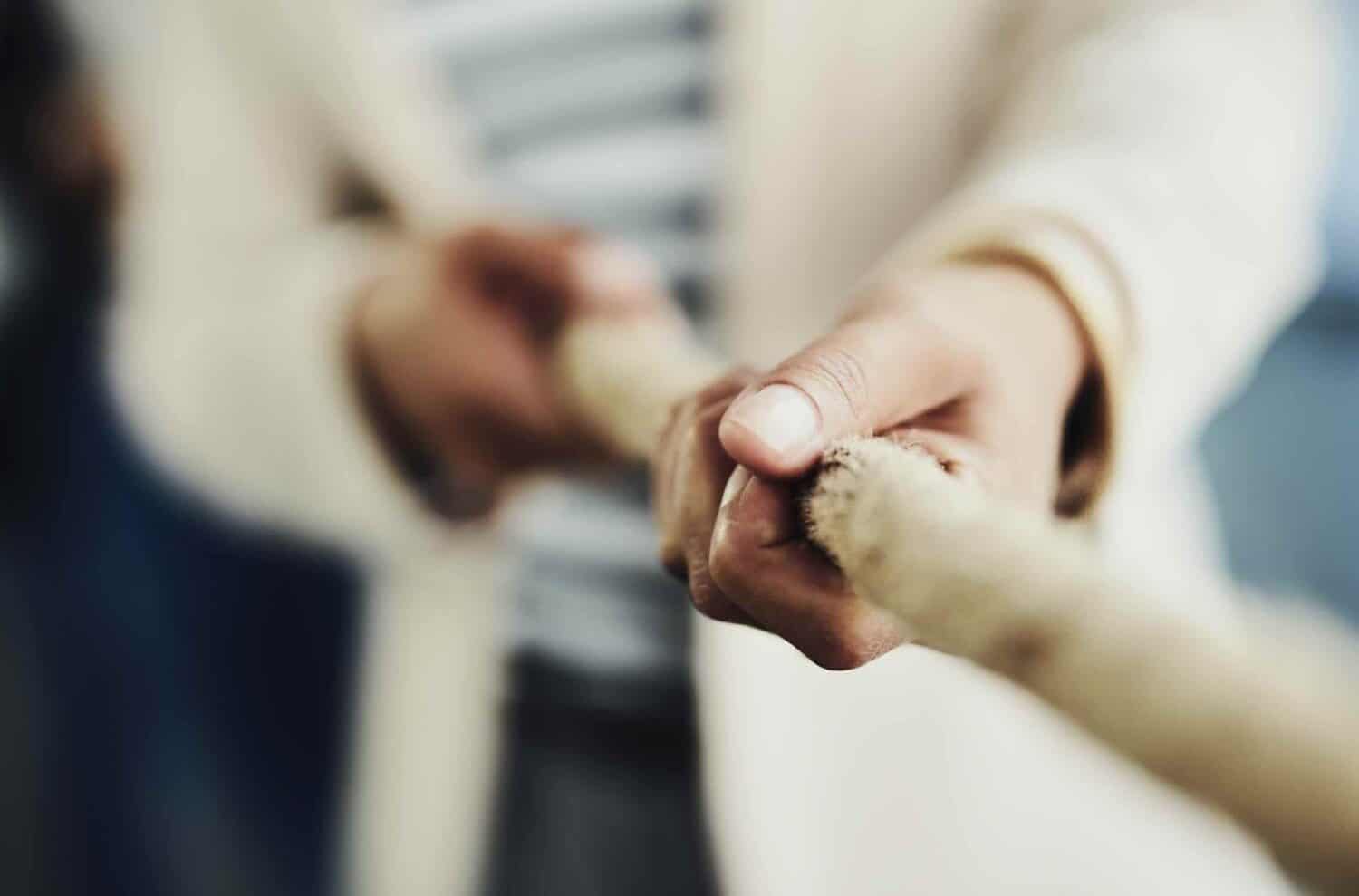 hands holding on to a rope