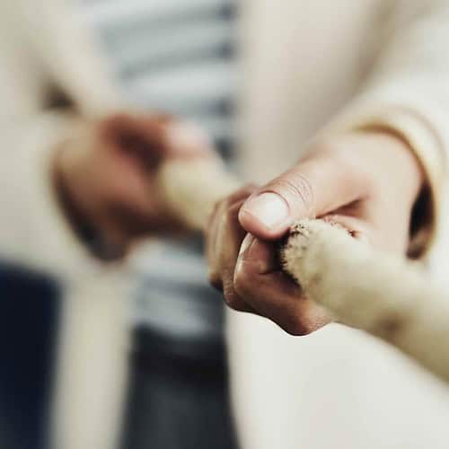 hands holding on to a rope