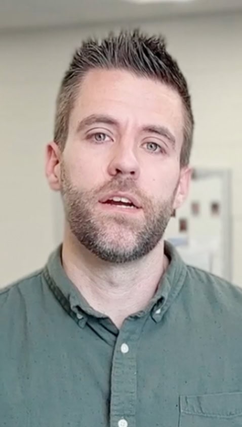 Caucasian man with beard and spiky hair