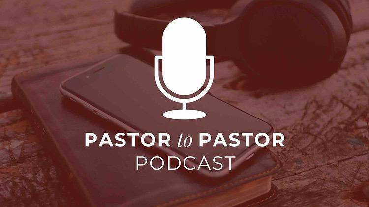 Microphone over a red-washed image of a bible, phone, and headphones