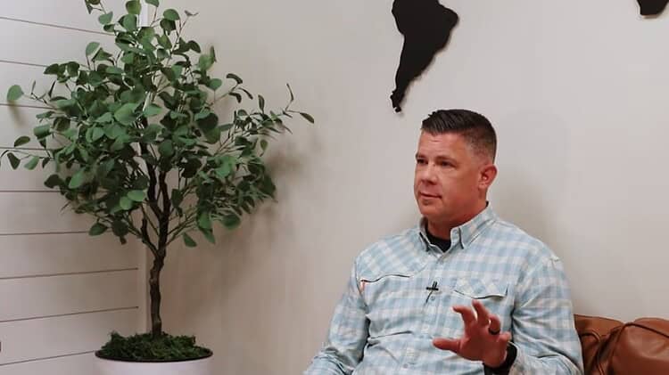 Man sitting on a couch in a interview