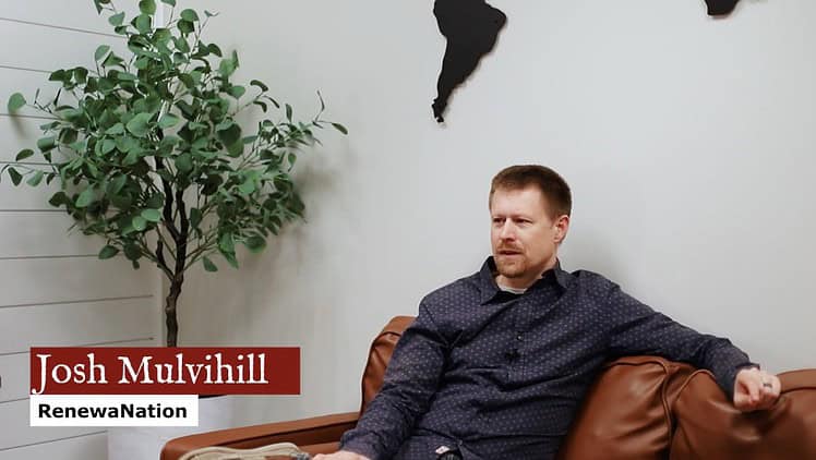 Young man sitting casually on a couch during interview