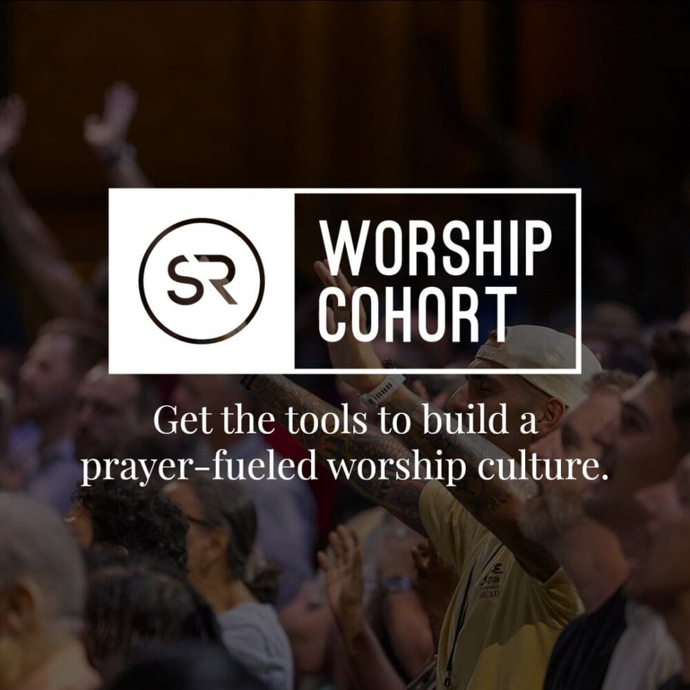 room full of people worshiping God with hands raised behind the logo for Strategic Renewal Worship Cohort