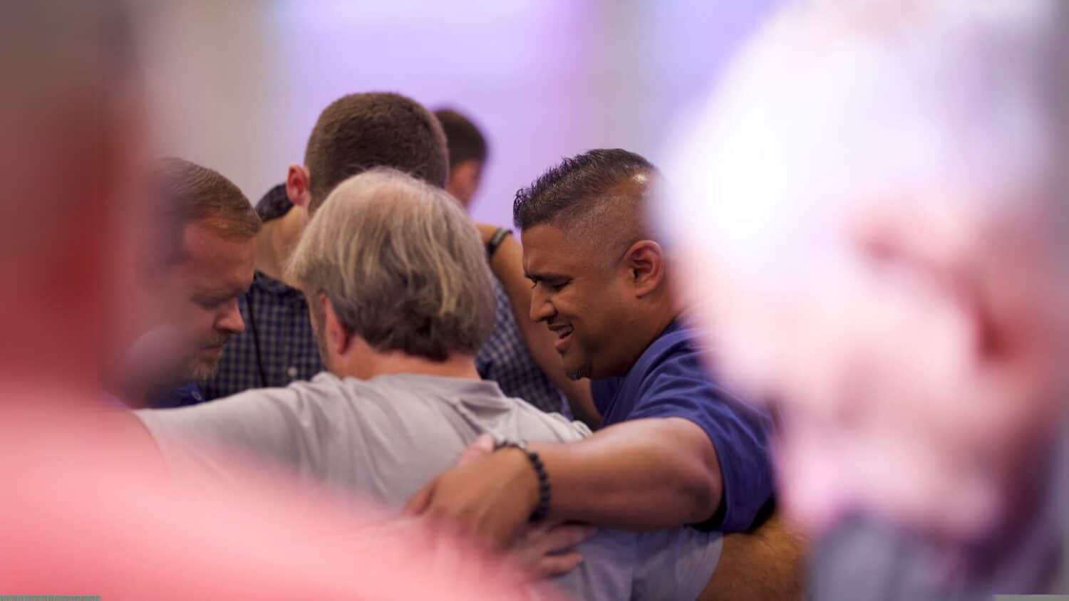 Pastors and church leaders praying together as they build a culture of prayer