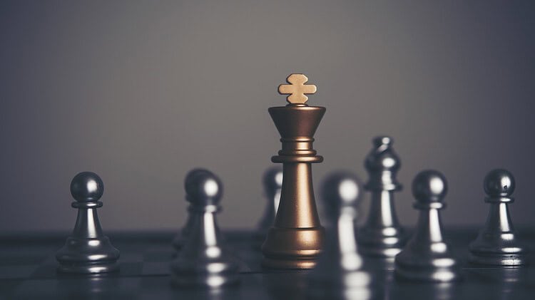 six chess pawns surrounding a golden king chess piece - symbolizing strategy, but with a biblical hint