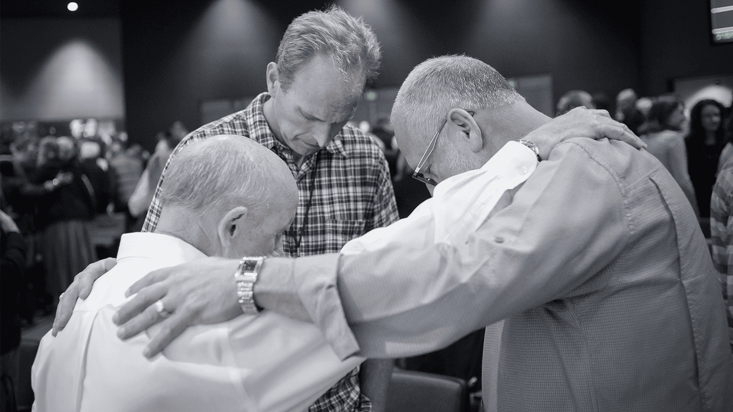 Three men praying