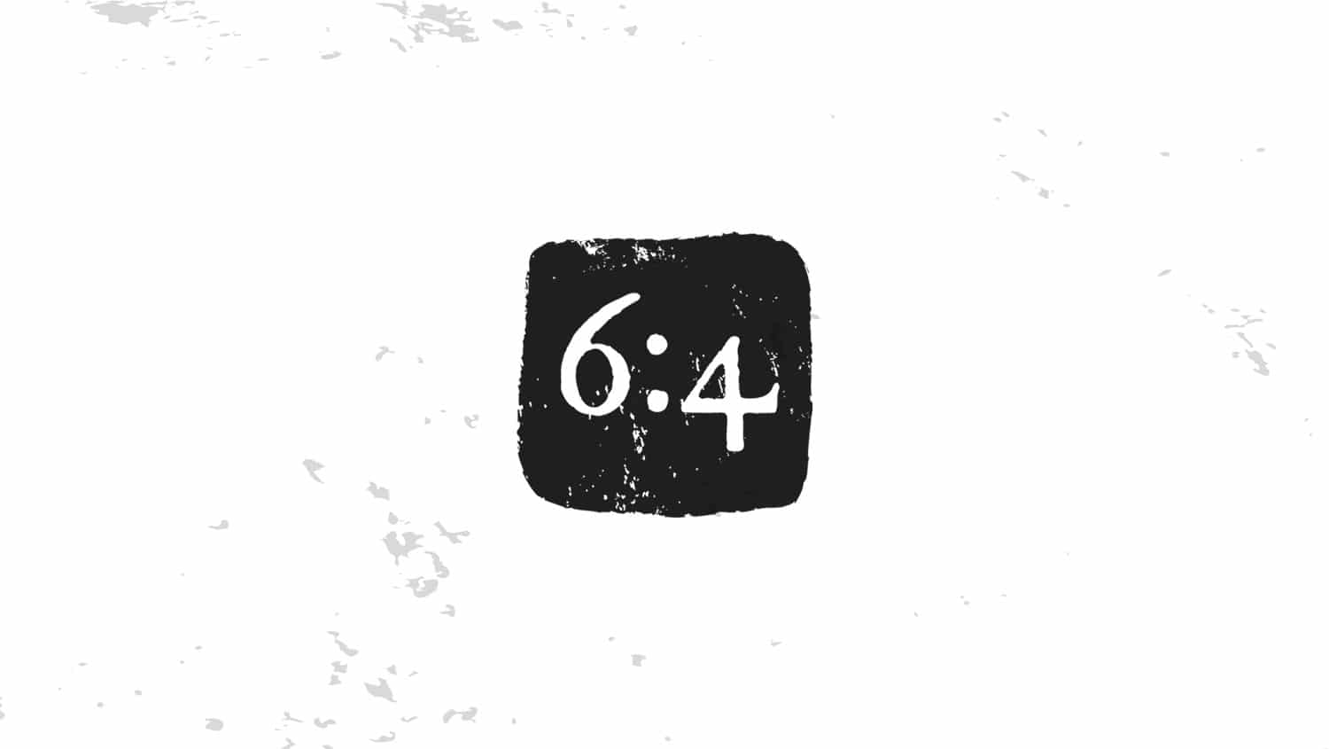 weathered black block that says 6:4 in it